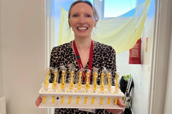 oral health service lady holding tooth brushes